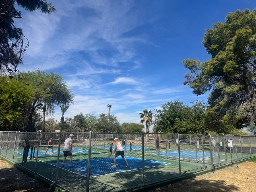 Guests playing on the pickleball courts at The Cove